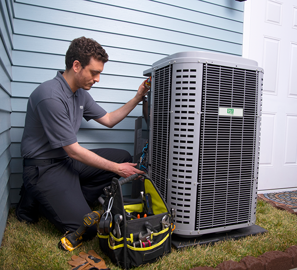 HVAC Tech working on unit Day & Night Products
